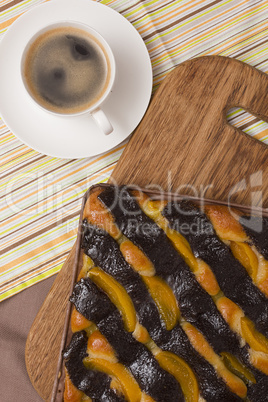 Coffee and cake with poppy seeds and orange