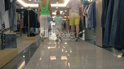 Family walking in clothing store
