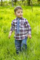 Little boy in shirt and jeans