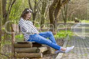 beautiful pregnant woman outdoor in the park