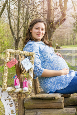 Beautiful pregnant woman outdoor in the park