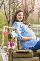 Beautiful pregnant woman outdoor in the park