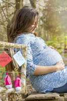 Pregnant woman outdoor thinking