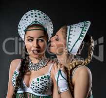 Portrait of two beautiful dancers in sexy costumes