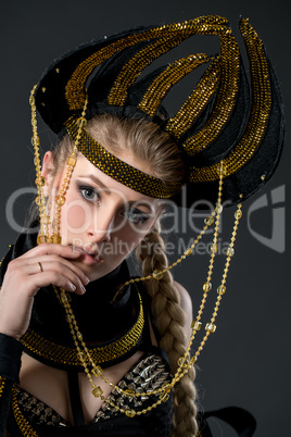 Portrait of beautiful go-go dancer in headdress