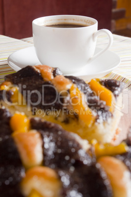 Coffee and cake with poppy seeds and orange