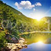 picturesque lake, mountains and blue sky