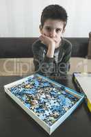 Child and puzzle.