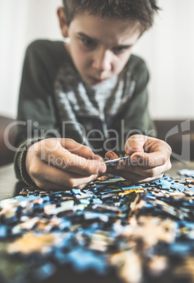 Child and puzzle.