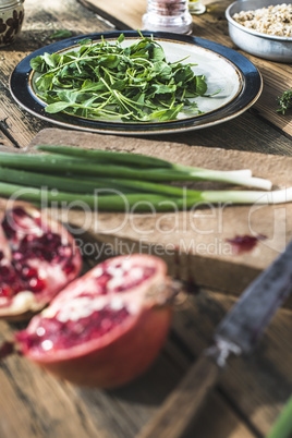 Green salad with pomegranate, manna croup, onion