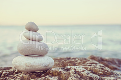 Instagram Pile of Stones on Tranquil Beach at Sunset