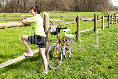 Woman with bike on the paddock
