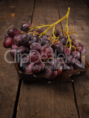 Delicious grapes in a ceramic bowl