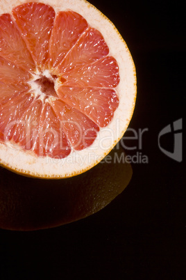 Cut half of juicy ripe grapefruit