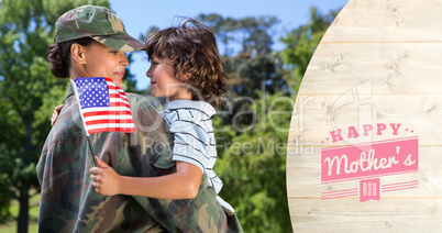 Composite image of army woman carrying son