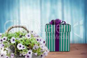 Composite image of blue and silver gift box