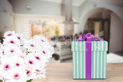 Composite image of blue and silver gift box