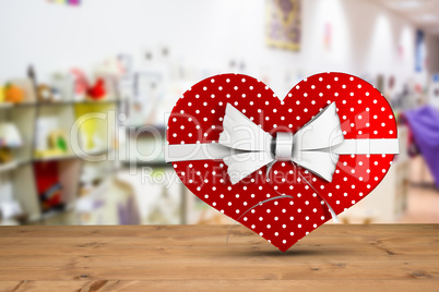 Composite image of heart shaped box of candy