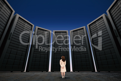 Composite image of rear view of businesswoman