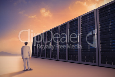 Composite image of rear view of businessman