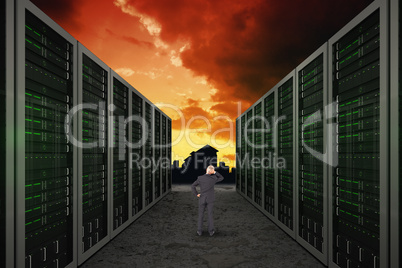 Composite image of rear view of doubtful mature businessman