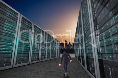 Composite image of rear view of businessman walking