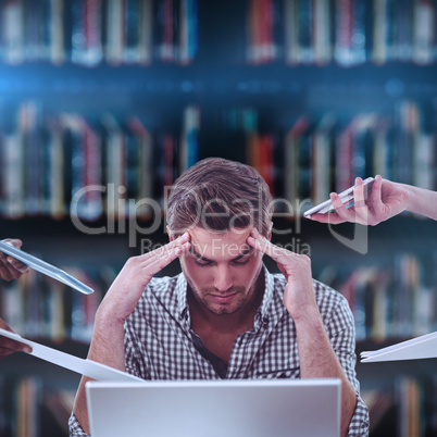 Composite image of businessman stressed out at work