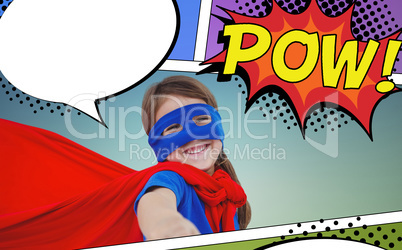 Composite image of smiling masked girl pretending to be superhero