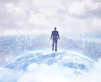 Composite image of businessman standing