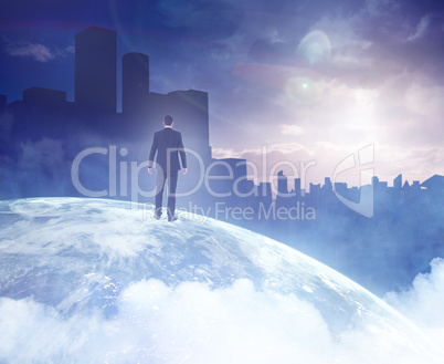 Composite image of rear view of businessman standing