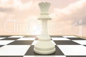 Composite image of white queen on chess board