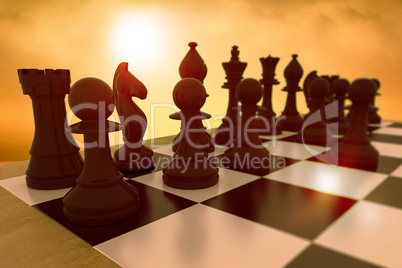 Composite image of black chess pieces on board