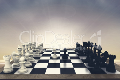 Composite image of black and white chess pieces on board