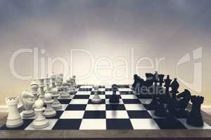 Composite image of black and white chess pieces on board