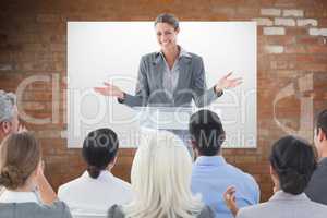 Composite image of businesswoman doing speech during meeting