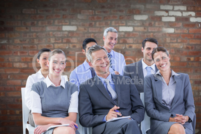 Composite image of business team during a meeting