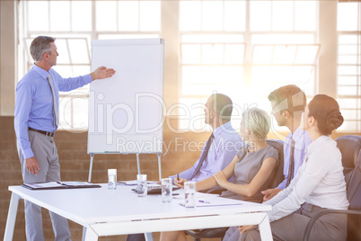 Composite image of business people listening during meeting