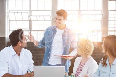 Composite image of group of young colleagues in a meeting