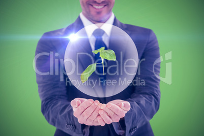 Composite image of smiling businessman presenting with hands