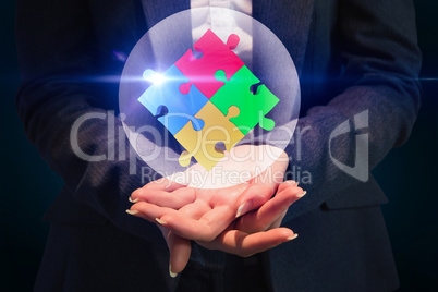 Composite image of businesswoman with hands out