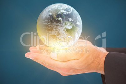 Composite image of businessman holding his hands out