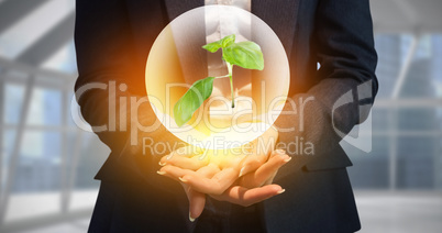 Composite image of businesswoman with hands out