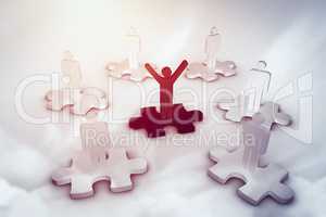 Composite image of digital image of human standing on jigsaw