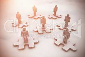Composite image of human figures on jigsaw