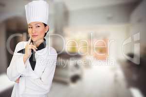 Composite image of portrait of thoughtful female cook in kitchen