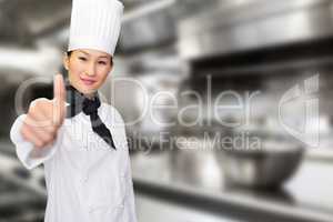 Composite image of smiling female cook gesturing thumbs up in kitchen
