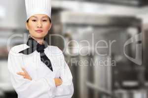 Composite image of portrait of confident female cook in kitchen