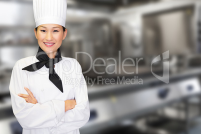Composite image of portrait of smiling female cook in kitchen Composite image of portrait of smiling female cook in kitchen