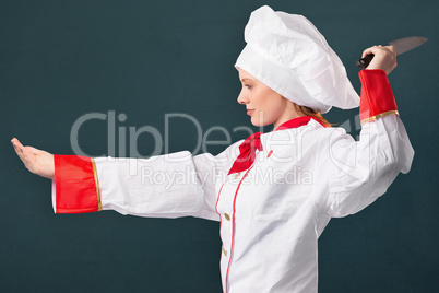Composite image of pretty chef slicing with knife