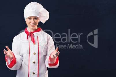 Composite image of pretty chef standing with hands out